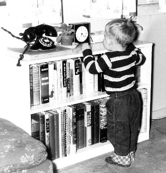 Bill Stoddard at 20 months old, looking a a Seth Thomas electric clock