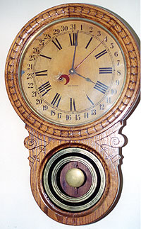 Seth Thomas oak cased wall clock